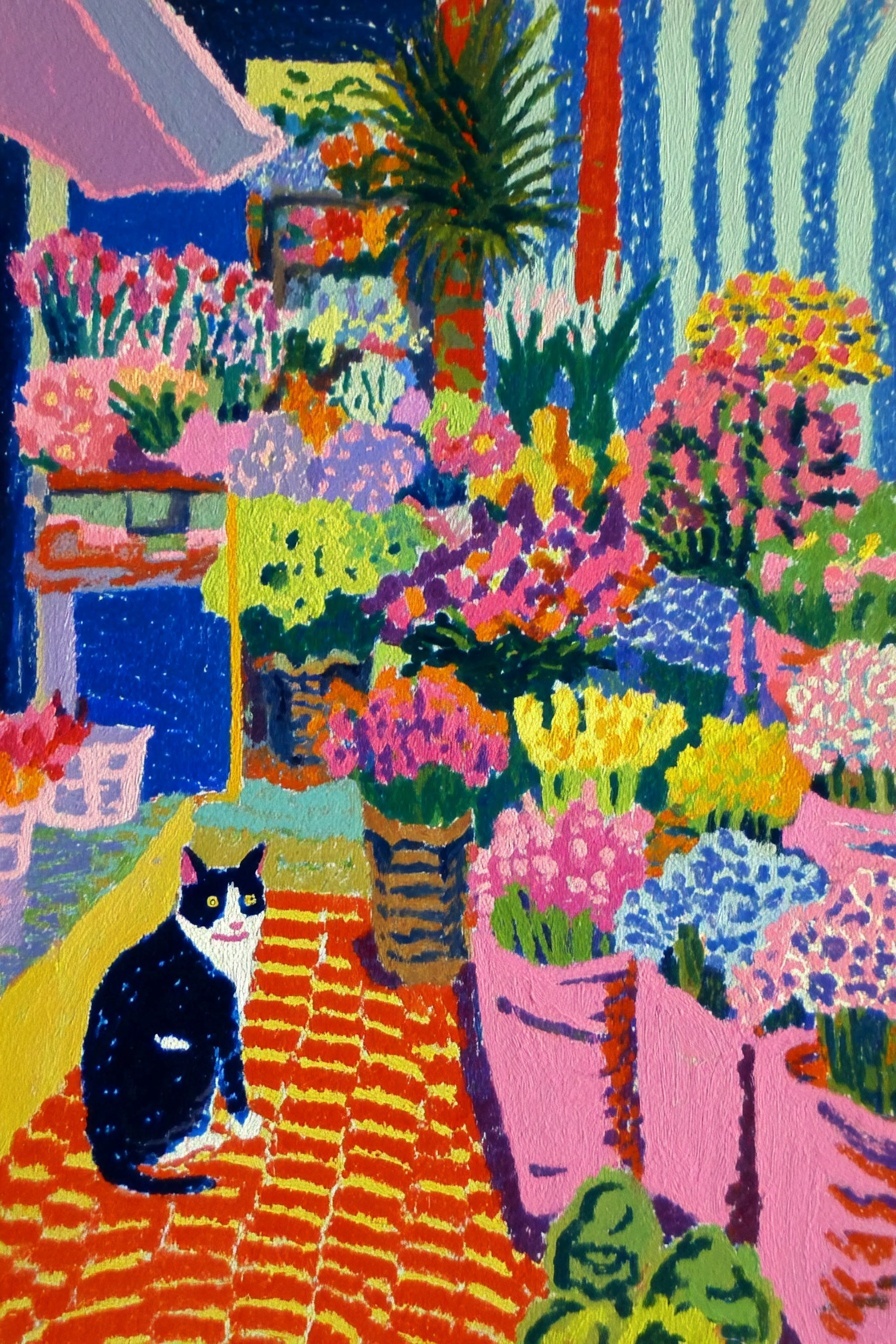 Gato blanco y negro en el mercado inglés de flores