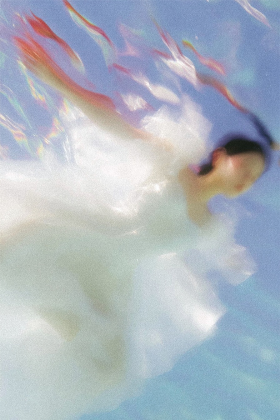 Ghost Woman Floating in a Vaporwave Ocean