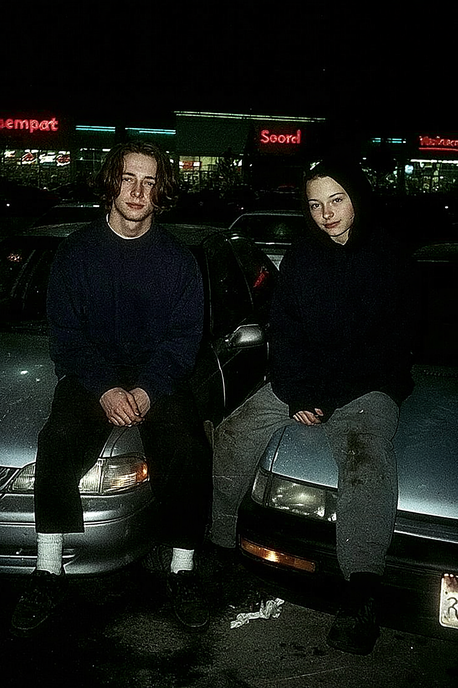 Teenagers in a 1990s Parking Lot