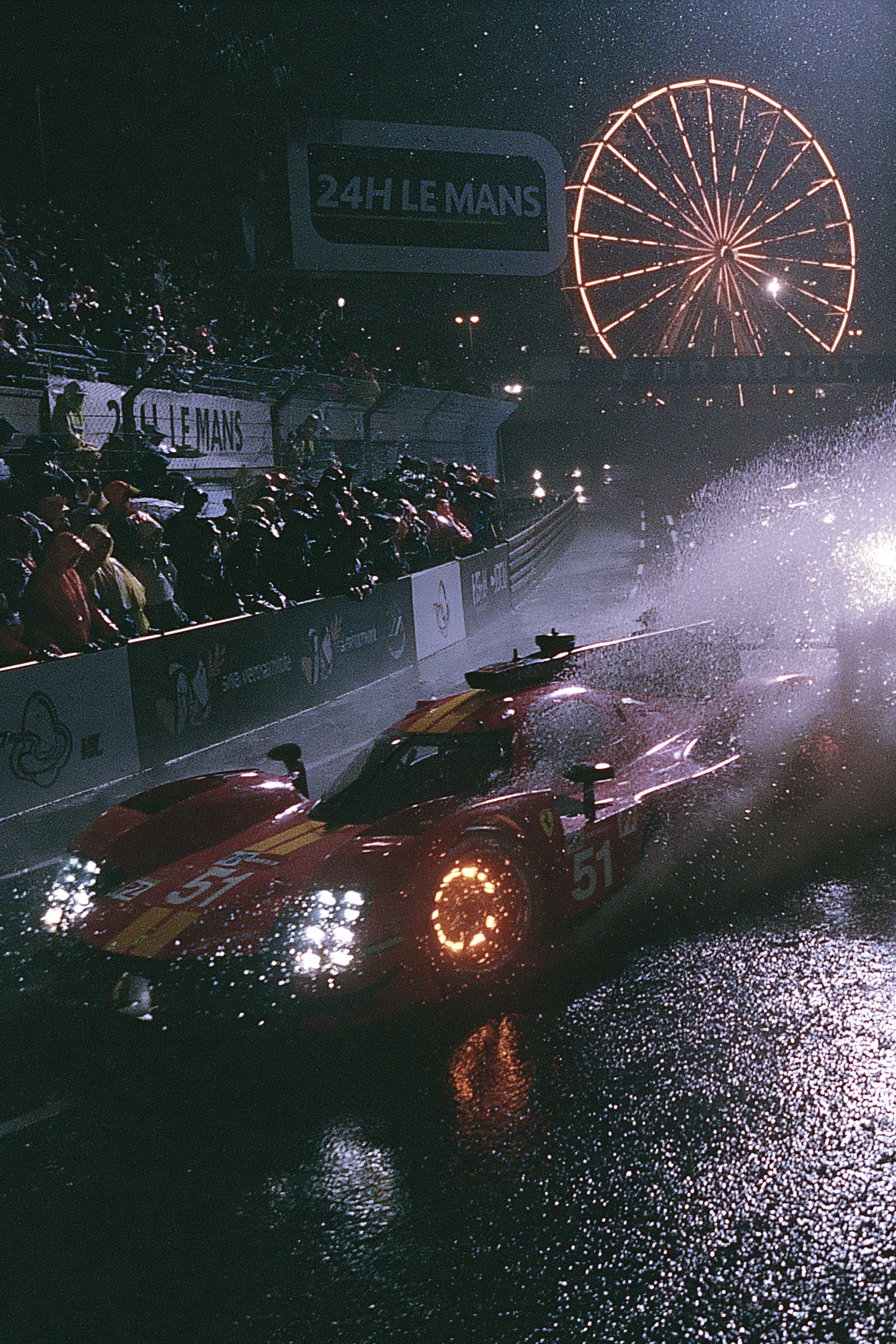 Ferrari 499P in a Rainy Le Mans Night