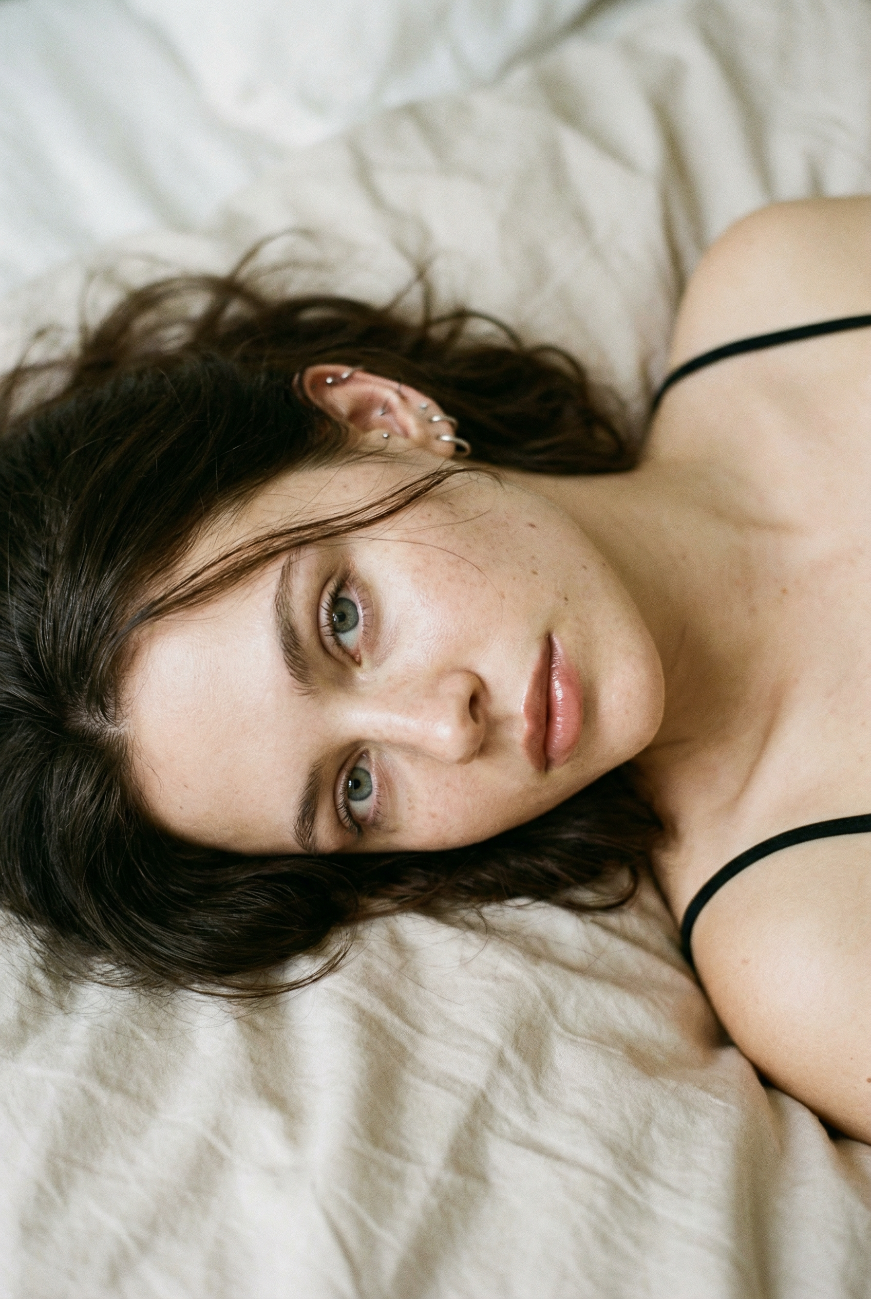 Freckled Woman in an Intimate Bedside Close-Up