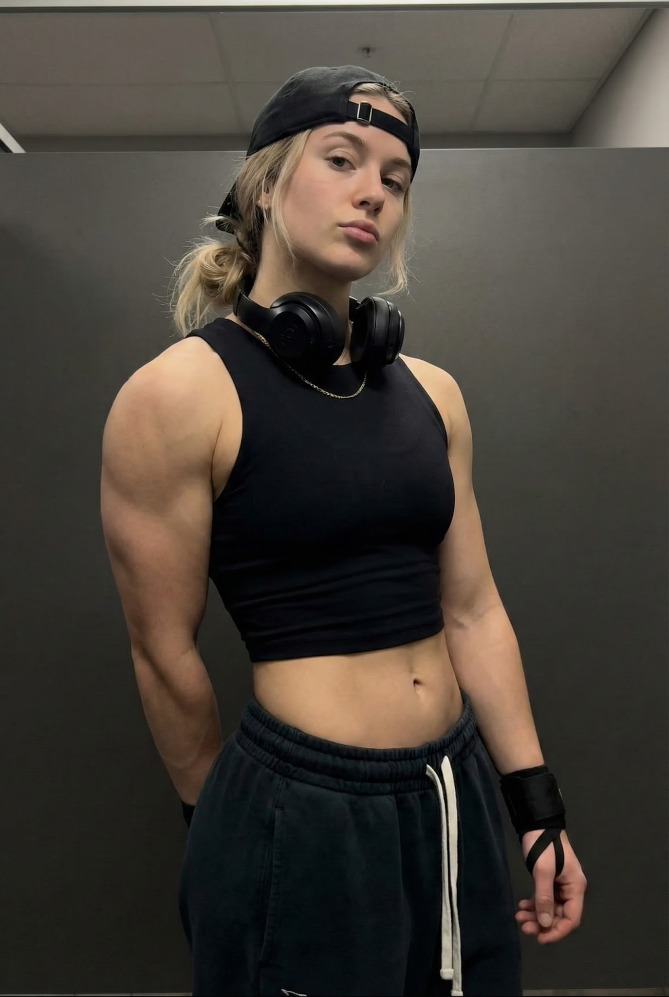Post-Workout Strength against a Dark Gray Wall